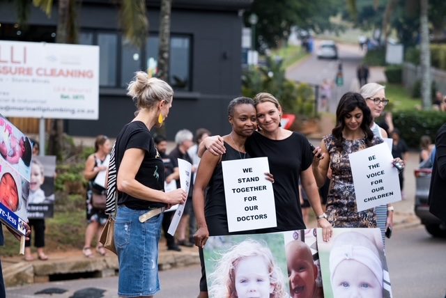 'Patients before profits' placards