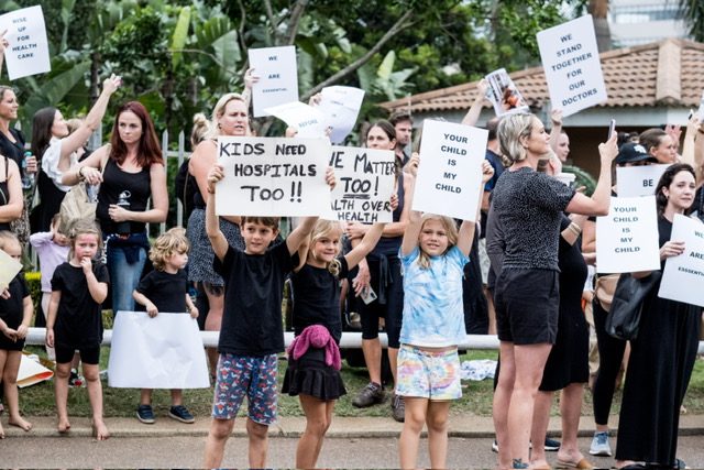 'Kids need hospitals too' placard