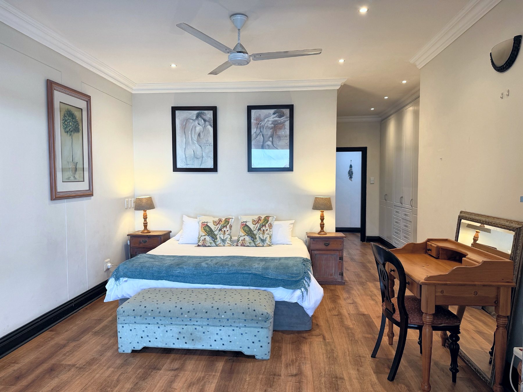 Main bedroom with king bed and writing desk