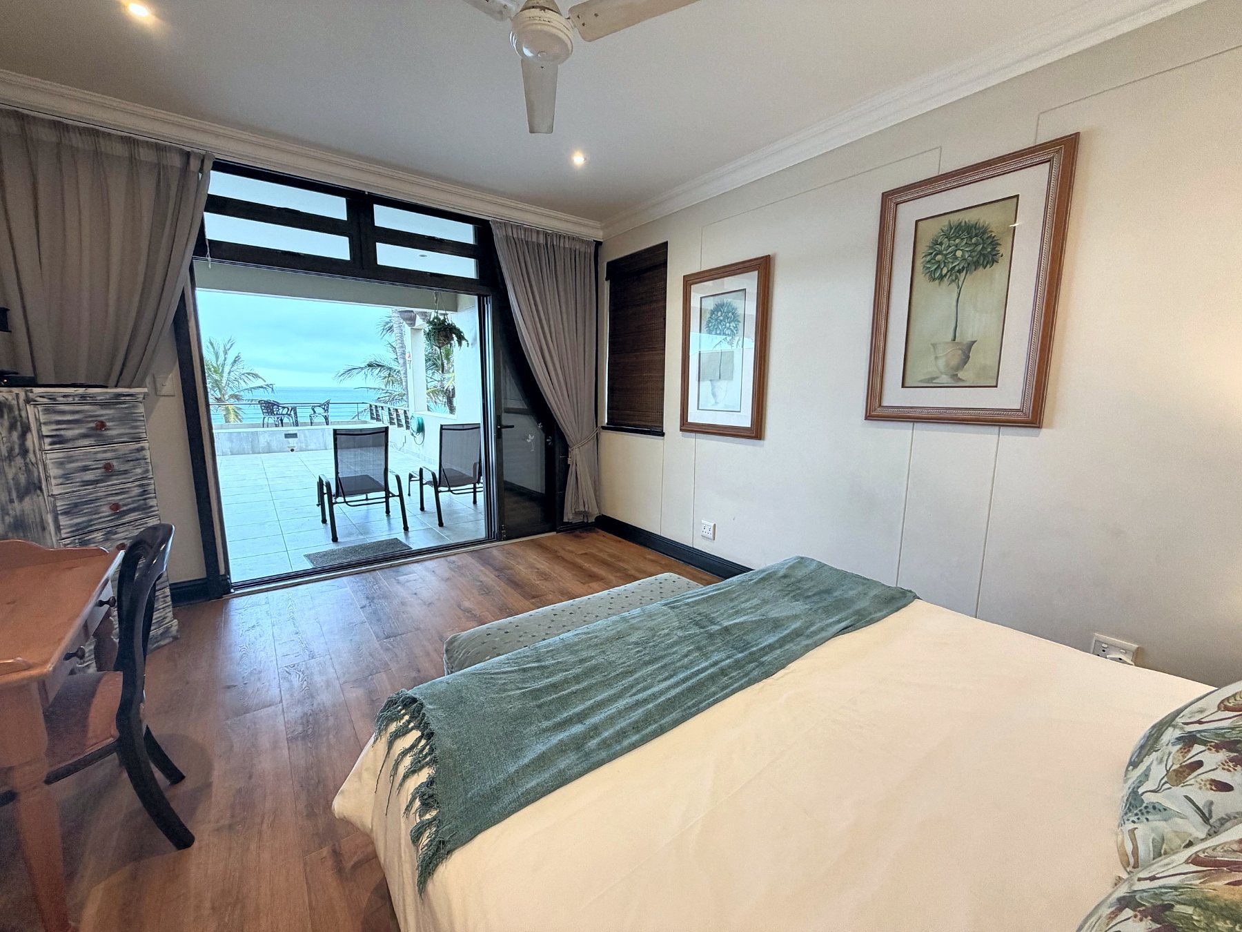 Main bedroom looking out through sliding doors to the sea