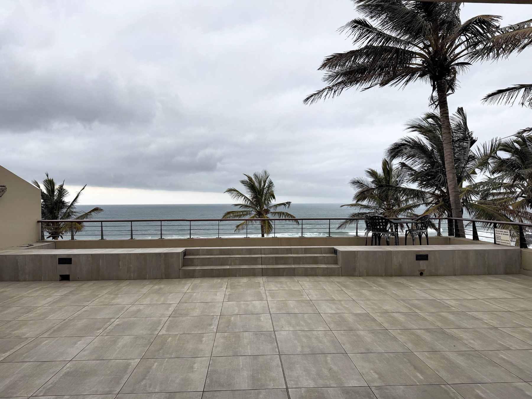 Raised balcony with steps down to the sea-facing balustrade