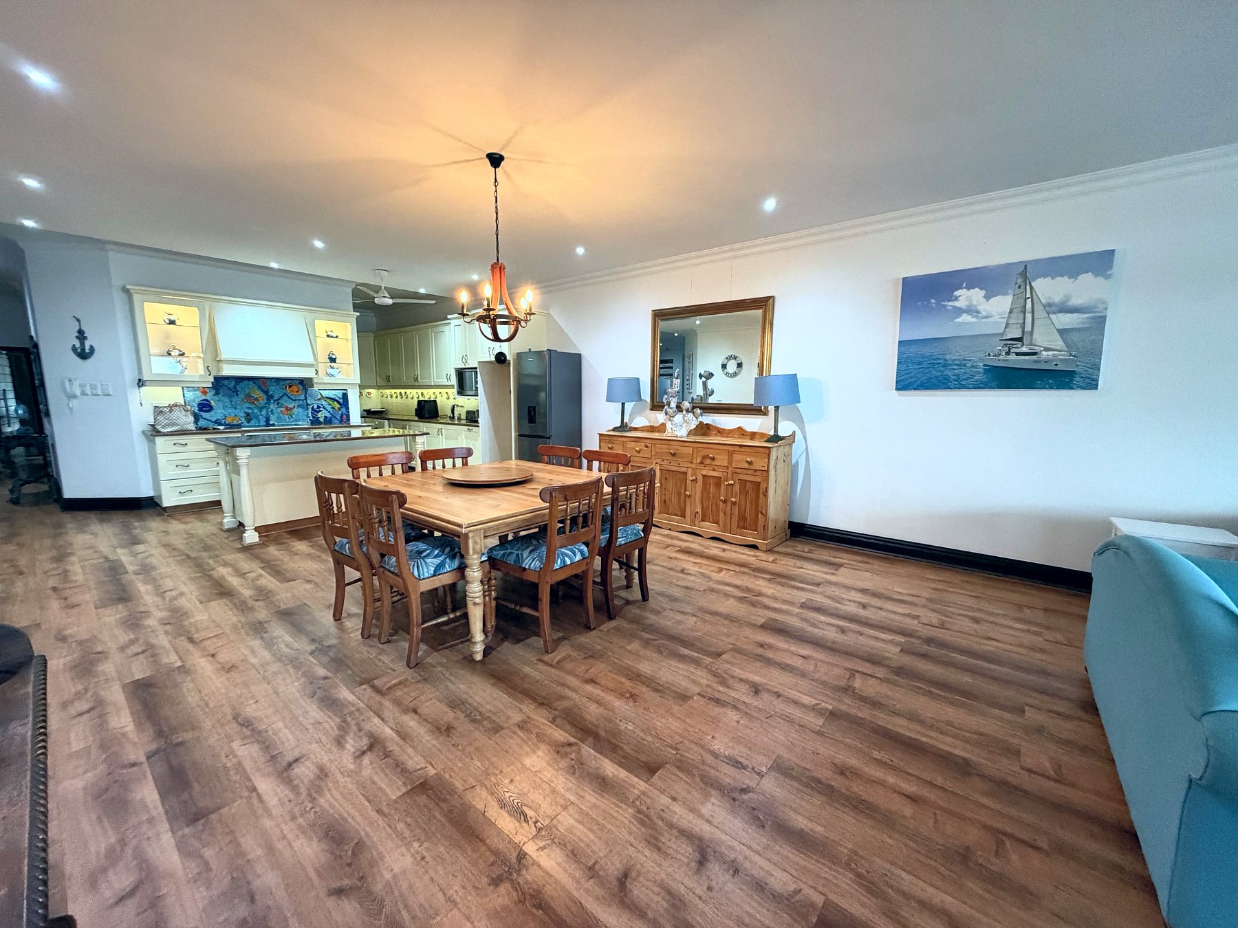 Dining table and open-plan kitchen