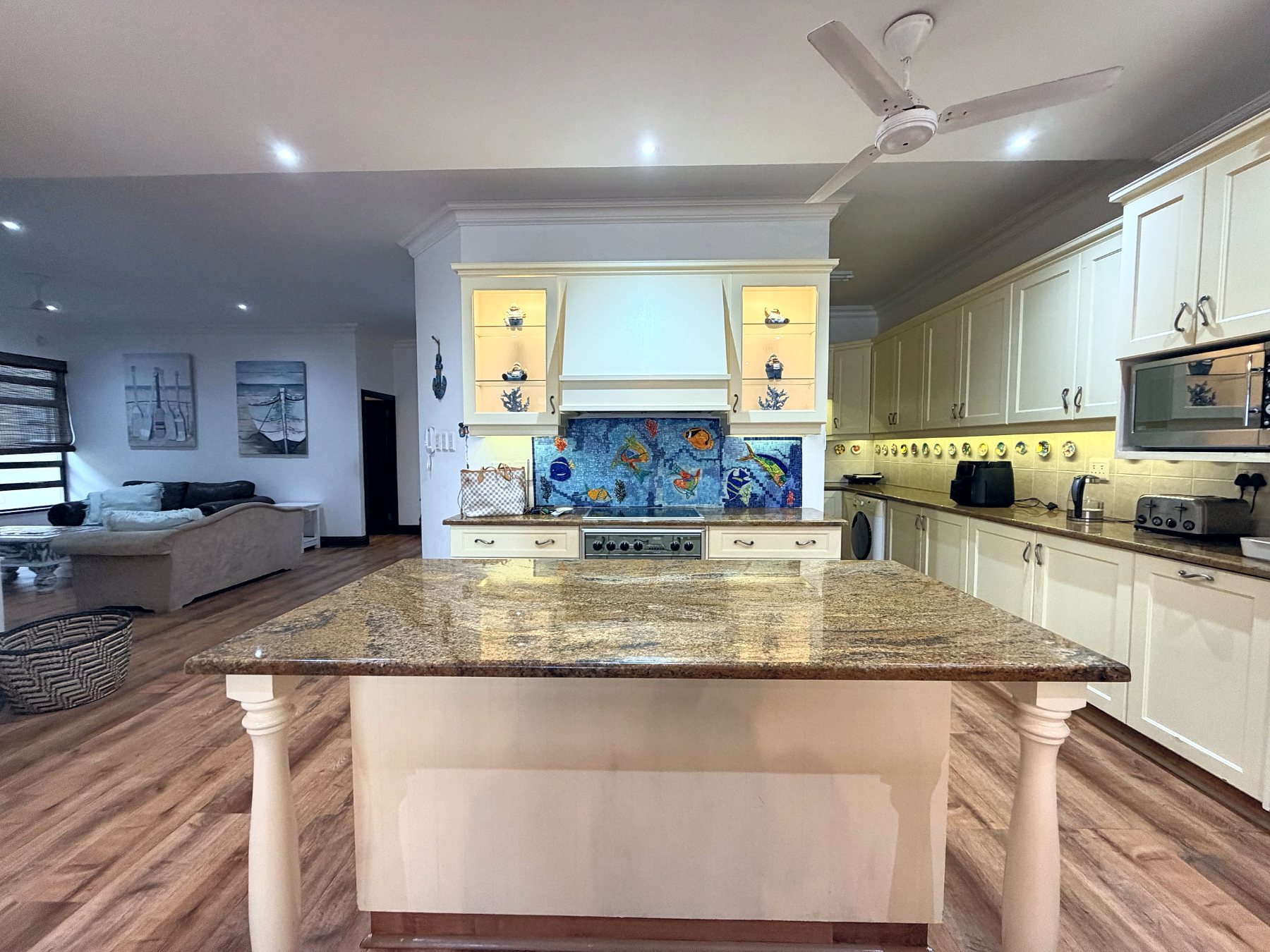 Kitchen with granite island and mosaic splashback